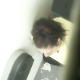 In what appears to be a genuine voyeur video, a hidden camera captures a woman shitting in a public restroom stall and wiping her ass. Poop sounds are clear, and we can see the shit on her toilet paper.
